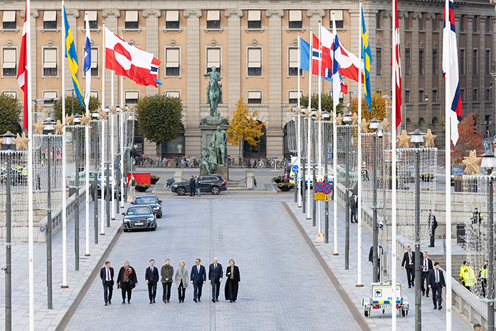 The Nordic prime ministers and government leaders and Ursula von der Leyen walk across the Norrbron Bridge in Stockholm.