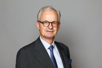 Half-length portrait of Christian Danielsson against a grey background.