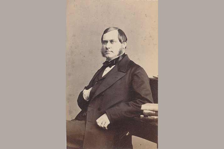 Louis De Geer the Elder sits at a desk.