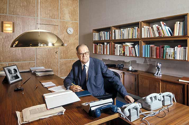 Tage Erlander at a desk in an office room.