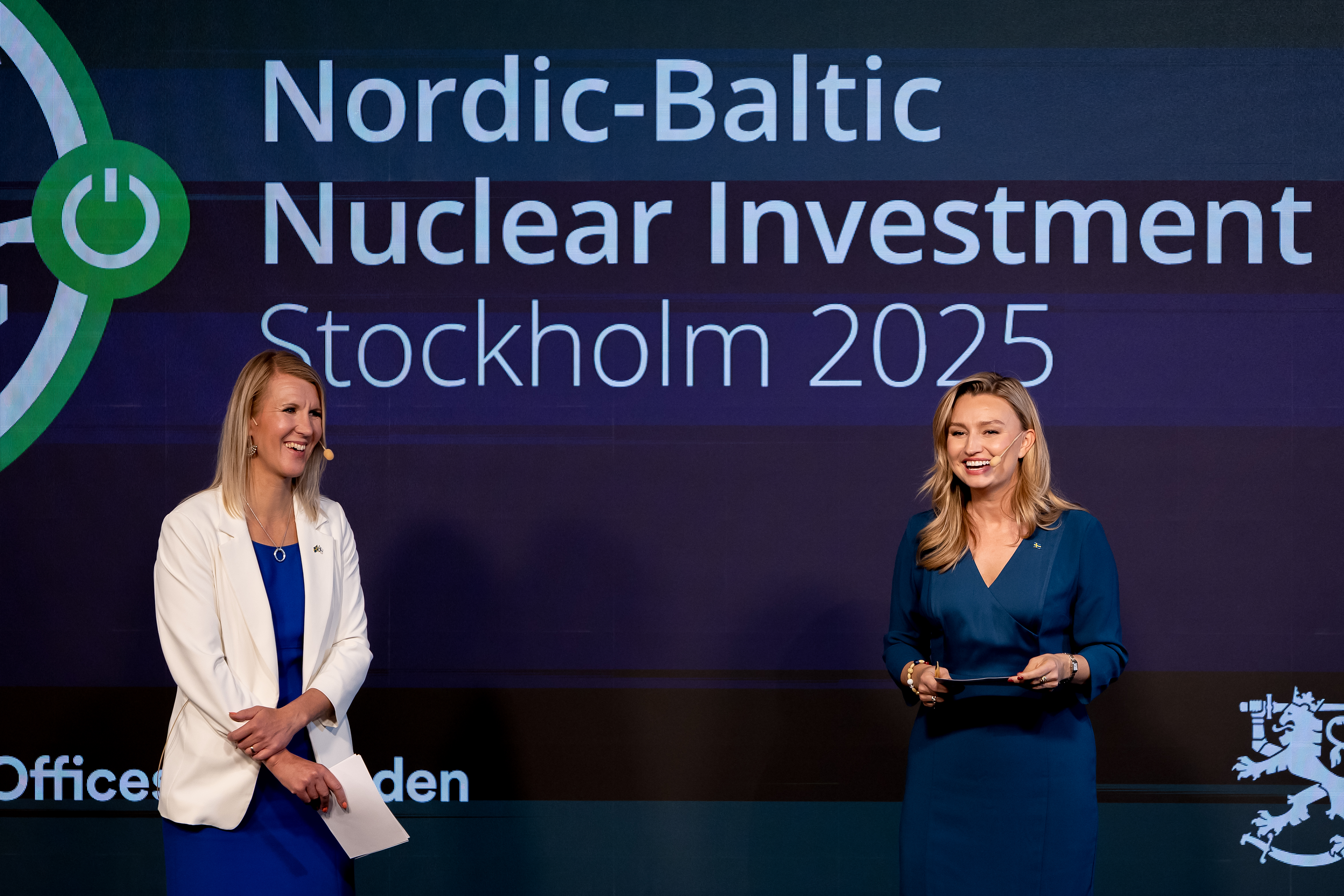 The two hostages for the conference on stage.