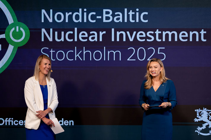 The two hostages for the conference on stage.