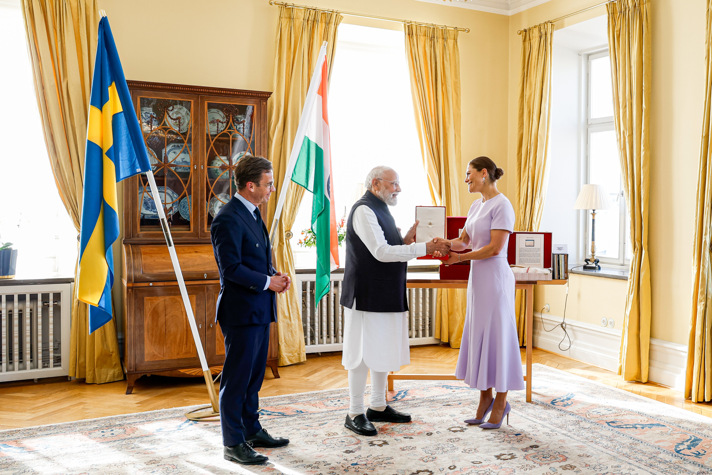The Prime Minister looks on as India’s Prime Minister receives the Order of the Polar Star from the Crown Princess.