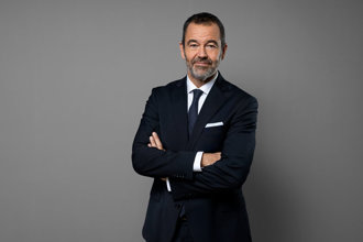 Half-length portrait of Johan Jakobsson against a grey background.