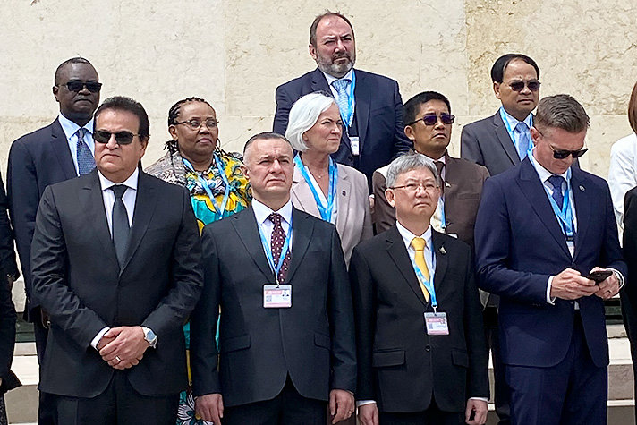 Ten women and men gathered for a photo session